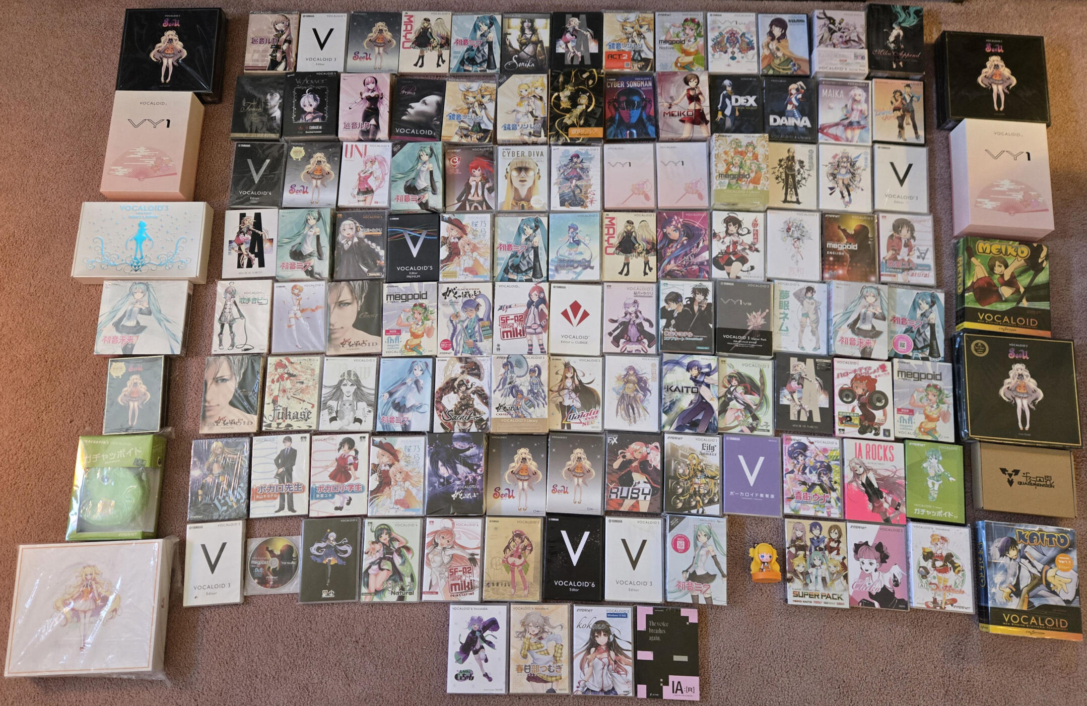 a picture of several physical vocaloids. most of them are official, but there's a few homemade boxes for download only products.