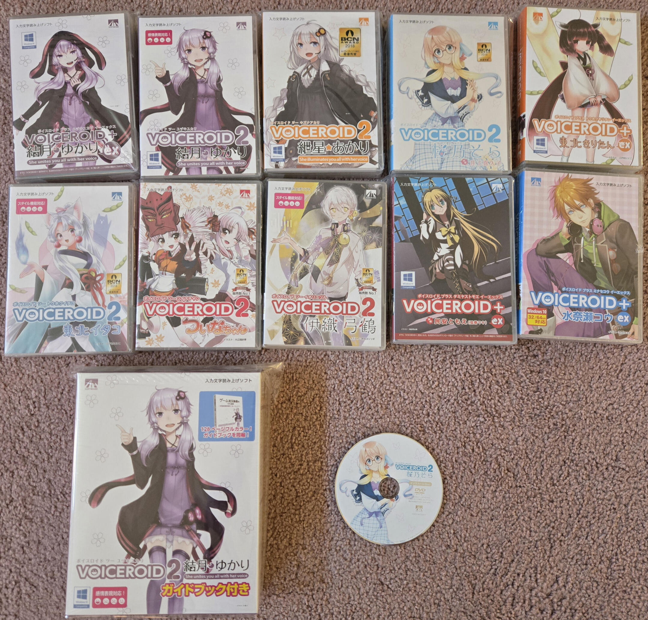 a picture of several physical voice roids as well as a extra disc for haruno sora..